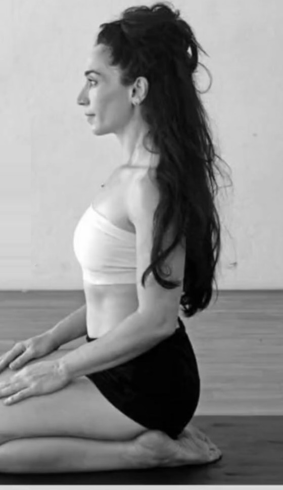 Rotem in a seated strength-training pose